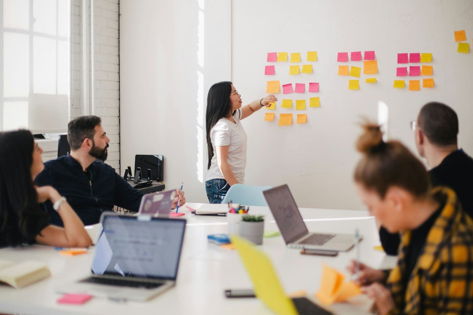 A strategy workshop with sticky notes on the wall
